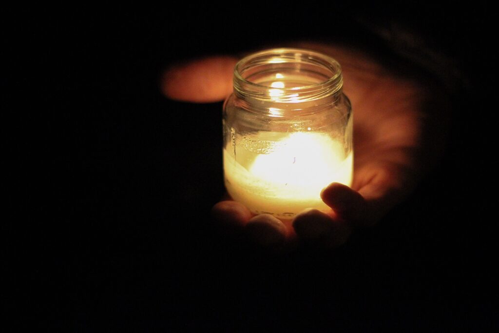 Candle at vigil at night