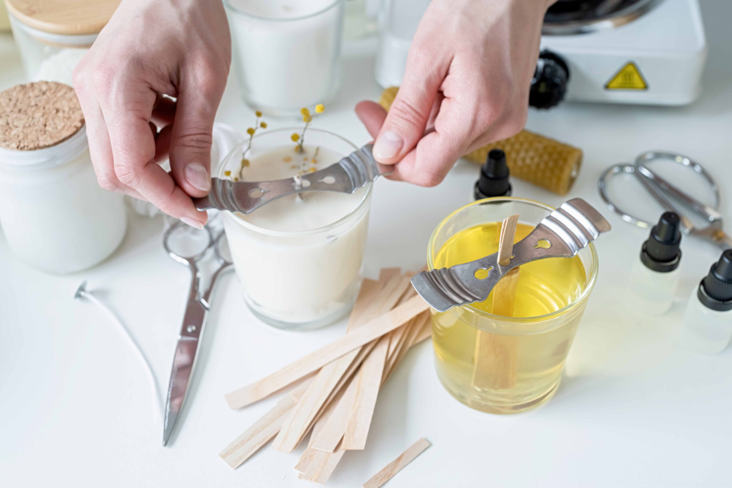 closeup of woman making candles. Candle Wicks and candle wax